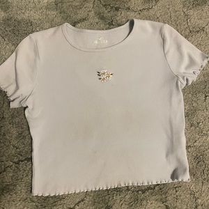 Violet color, white floral embroidery on front, short sleeve, crop tee.